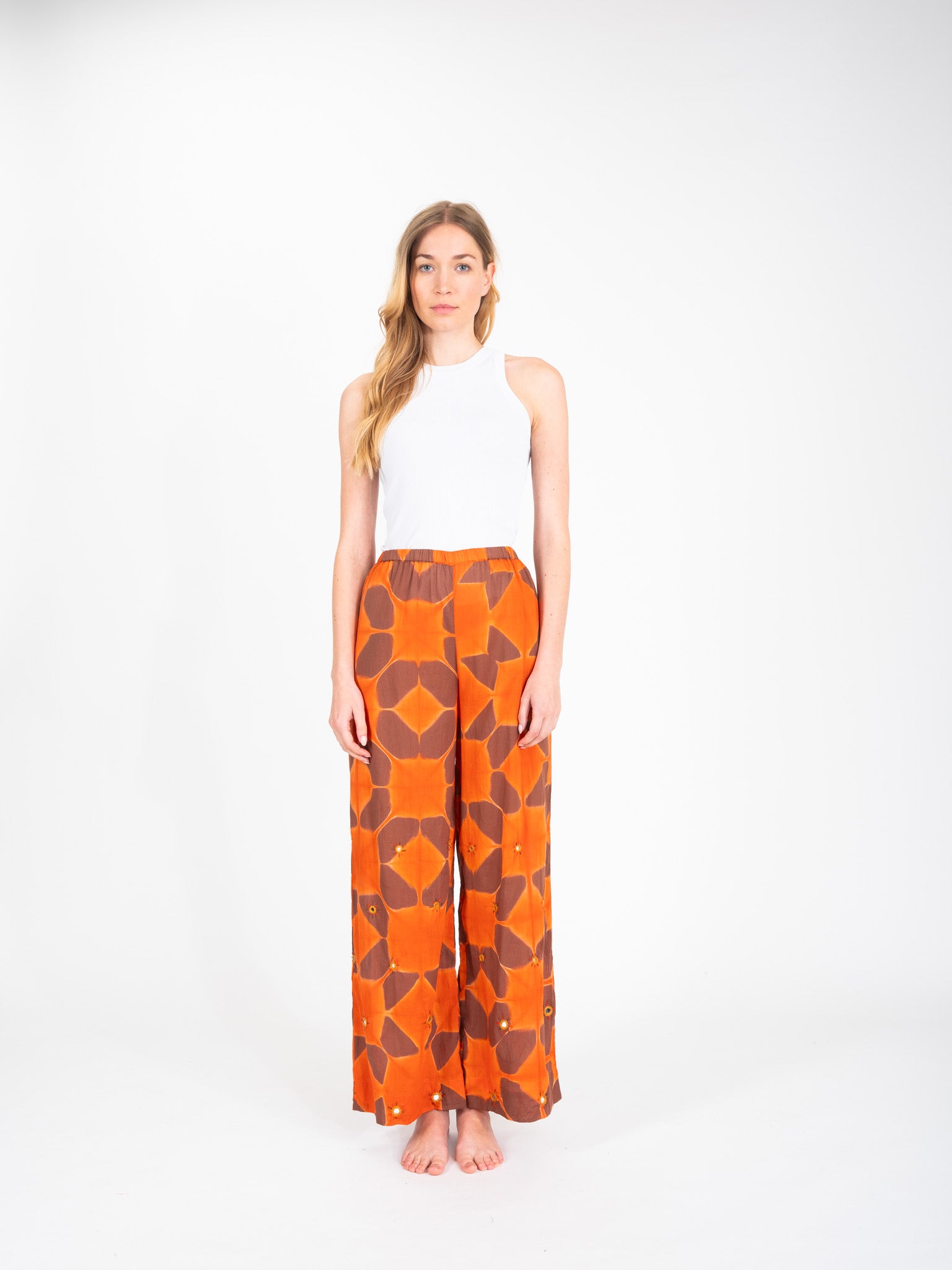Cramp embroidered orange tie-dye pants