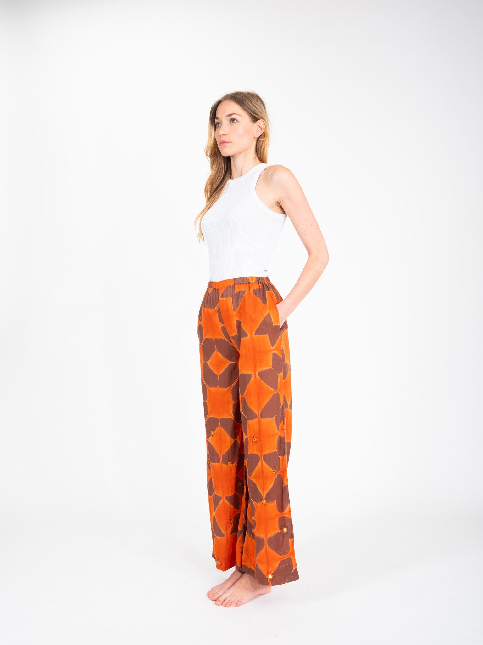 Cramp embroidered orange tie-dye pants