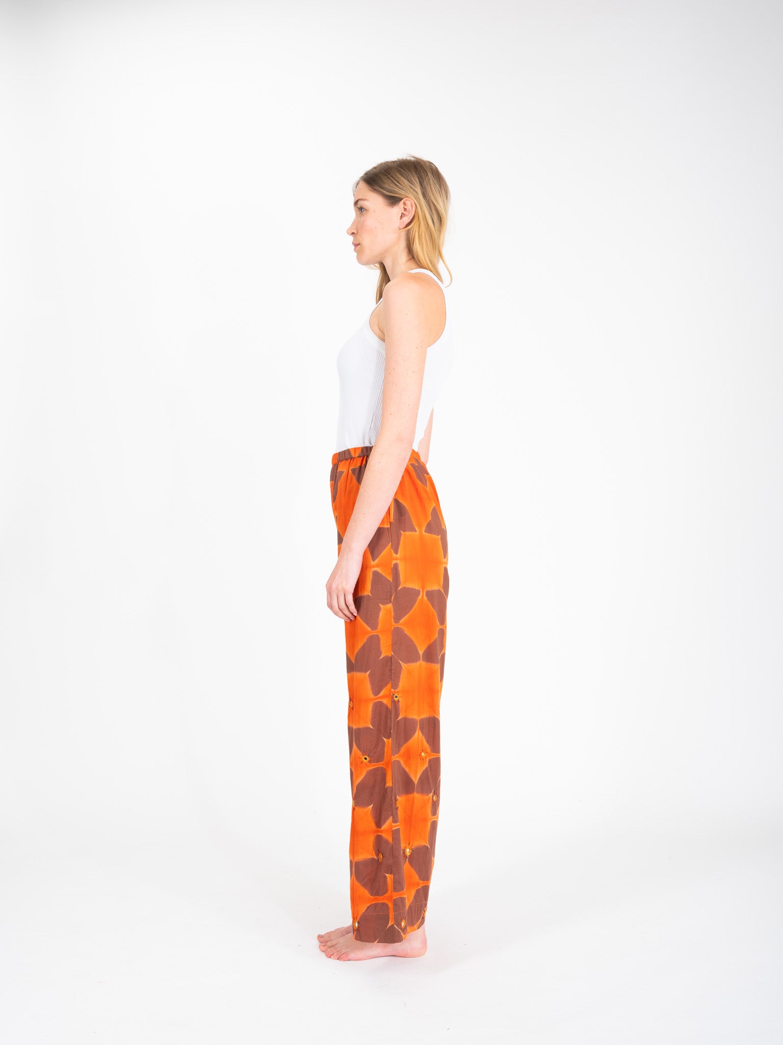 Cramp embroidered orange tie-dye pants